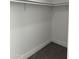 Spacious closet with double rods and grey vinyl flooring at 38007 W Mcdowell Rd, Tonopah, AZ 85354