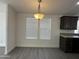 Bright dining room features light gray flooring, recessed lighting and two large windows at 38007 W Mcdowell Rd, Tonopah, AZ 85354