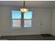 Entryway with view of desert landscape, gray flooring, and white door at 38007 W Mcdowell Rd, Tonopah, AZ 85354