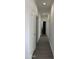 Long hallway with doors to bedrooms and bathroom at 38007 W Mcdowell Rd, Tonopah, AZ 85354