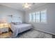 Bright bedroom featuring a plush bed and area rug at 3888 E Hazeltine Way, Chandler, AZ 85249