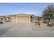 Three-car garage home with desert landscaping at 3888 E Hazeltine Way, Chandler, AZ 85249