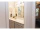 Clean bathroom with vanity, mirror, and linen storage at 3907 S 78Th Ln, Phoenix, AZ 85043