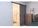 Clean bathroom with a walk-in shower and barn door at 3907 S 78Th Ln, Phoenix, AZ 85043