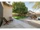 Nice backyard with artificial turf and patio at 3950 S Cactus Wren Dr, Chandler, AZ 85248