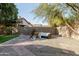 Landscaped backyard with artificial turf and seating at 3950 S Cactus Wren Dr, Chandler, AZ 85248