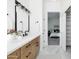 Spa-like bathroom with marble flooring and a view into the bedroom beyond at 3950 S Cactus Wren Dr, Chandler, AZ 85248