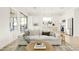 Living area with light-colored sofa and woven coffee table at 3950 S Cactus Wren Dr, Chandler, AZ 85248