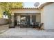 Outdoor patio with seating area and screened enclosure at 3950 S Cactus Wren Dr, Chandler, AZ 85248