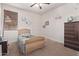 Cozy bedroom with light wood bed frame and dresser at 4165 E Toledo St, Gilbert, AZ 85295