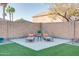 Relaxing backyard patio with lounge chairs at 4340 E Silverbell Rd, San Tan Valley, AZ 85143