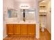 Bathroom with double vanity, toilet, and linen closet at 4340 E Silverbell Rd, San Tan Valley, AZ 85143