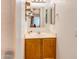 Small bathroom with wood vanity and single sink at 4340 E Silverbell Rd, San Tan Valley, AZ 85143