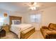 Cozy bedroom with a comfortable bed and additional seating at 4340 E Silverbell Rd, San Tan Valley, AZ 85143