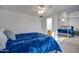 Bedroom with a blue comforter and mirrored closet doors at 4340 E Silverbell Rd, San Tan Valley, AZ 85143