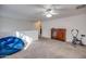 Bright bedroom with a dresser, exercise bike, and beanbag chair at 4340 E Silverbell Rd, San Tan Valley, AZ 85143