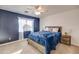 Bright bedroom with a blue comforter and wooden nightstand at 4340 E Silverbell Rd, San Tan Valley, AZ 85143