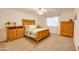 Bedroom with wood bed frame and dresser at 4340 E Silverbell Rd, San Tan Valley, AZ 85143