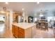 Kitchen with island, hardwood floors, and view into Gathering room at 4340 E Silverbell Rd, San Tan Valley, AZ 85143