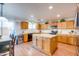 Spacious kitchen with island, stainless steel appliances, and light wood cabinets at 4340 E Silverbell Rd, San Tan Valley, AZ 85143