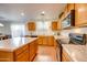 Bright kitchen with an island, stainless steel appliances, and wood cabinets at 4340 E Silverbell Rd, San Tan Valley, AZ 85143