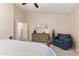 Relaxing bedroom with dresser and comfy armchair at 4611 E Red Bird Rd, Cave Creek, AZ 85331