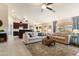 Open concept living room with adjacent kitchen and island at 4611 E Red Bird Rd, Cave Creek, AZ 85331