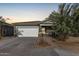 One-story home with a two-car garage and desert landscaping at 4718 N 193Rd Dr, Litchfield Park, AZ 85340