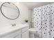 Clean bathroom with white vanity, tub, and polka dot shower curtain at 4730 W Northern Ave # 1127, Glendale, AZ 85301