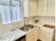 Clean kitchen featuring white cabinets and double sink at 4730 W Northern Ave # 1127, Glendale, AZ 85301