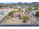 Aerial view of a ranch-style house with a large backyard and pool at 4805 W Saguaro Park Ln, Glendale, AZ 85310