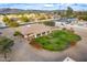 Aerial view of single-story home with large backyard, pool, and mountain views at 4805 W Saguaro Park Ln, Glendale, AZ 85310