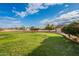 Expansive grassy backyard with mature trees at 4805 W Saguaro Park Ln, Glendale, AZ 85310