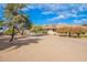 Landscaped backyard with gravel and trees at 4805 W Saguaro Park Ln, Glendale, AZ 85310