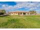 Expansive grassy backyard with home view at 4805 W Saguaro Park Ln, Glendale, AZ 85310