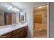 Bathroom with vanity, bathtub, and shower at 4805 W Saguaro Park Ln, Glendale, AZ 85310