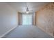 Bedroom with ceiling fan and sliding door to backyard at 4805 W Saguaro Park Ln, Glendale, AZ 85310