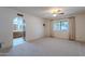 Spacious bedroom with ensuite bathroom access and ceiling fan at 4805 W Saguaro Park Ln, Glendale, AZ 85310