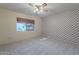 Bedroom with window and patterned wallpaper at 4805 W Saguaro Park Ln, Glendale, AZ 85310