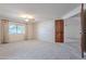 Bright bedroom with window, ceiling fan, and view of backyard at 4805 W Saguaro Park Ln, Glendale, AZ 85310