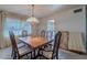 Dining room with wood table and chairs near a doorway at 4805 W Saguaro Park Ln, Glendale, AZ 85310