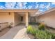 Front entry with decorative door and covered porch at 4805 W Saguaro Park Ln, Glendale, AZ 85310