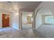 Bright entryway with tile floors and views into the living room at 4805 W Saguaro Park Ln, Glendale, AZ 85310