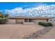 Single-story home with a tile roof and landscaped yard at 4805 W Saguaro Park Ln, Glendale, AZ 85310