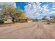 View of house from the street, showing landscaping and driveway at 4805 W Saguaro Park Ln, Glendale, AZ 85310