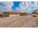 View of the home's side, showing a two car garage at 4805 W Saguaro Park Ln, Glendale, AZ 85310