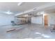 Garage with shelving, workbench, and an attached bathroom at 4805 W Saguaro Park Ln, Glendale, AZ 85310