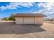 Detached garage with a brown tile roof at 4805 W Saguaro Park Ln, Glendale, AZ 85310