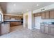 Kitchen with wood cabinets and granite countertops at 4805 W Saguaro Park Ln, Glendale, AZ 85310