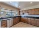 Kitchen with a large window overlooking the backyard at 4805 W Saguaro Park Ln, Glendale, AZ 85310